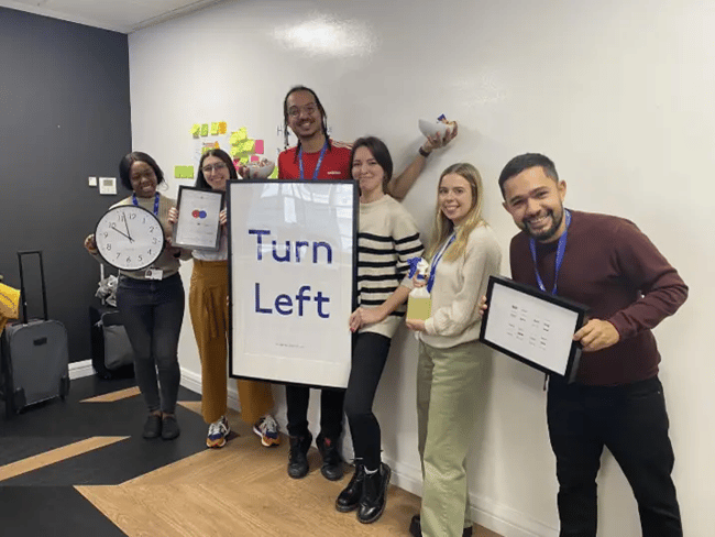 Smiling people in a meeting room.